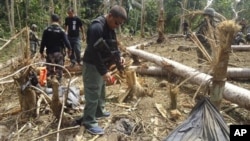 Philippine forces examine site where three most wanted leaders of al-Qaida-linked terrorist groups Abu Sayyaf and Jemaah Islamiyah were among those allegedly killed.
