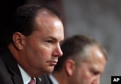 Sen. Mike Lee, R-Utah, listens during a Senate Armed Services Committee on Capitol Hill in Washington, July 21, 2015.