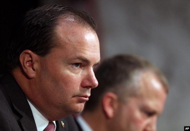 Sen. Mike Lee, R-Utah, listens during a Senate Armed Services Committee on Capitol Hill in Washington, July 21, 2015.