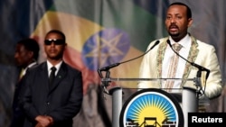 FILE - Ethiopia's Prime Minister Abiy Ahmed addresses his country's diaspora, the largest outside Ethiopia, calling on them to return, invest and support their native land. He spoke in Washington, July 28, 2018.