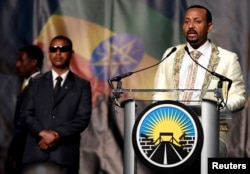 FILE - Ethiopia's Prime Minister Abiy Ahmed addresses his country's diaspora, the largest outside Ethiopia, calling on them to return, invest and support their native land. He spoke in Washington, July 28, 2018.