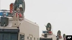 Saudi Arabian troops cross the causeway leading to Bahrain in this still image taken from video, March 14, 2011
