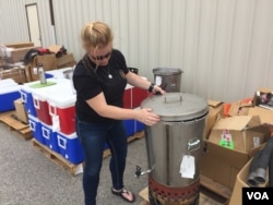 Have you seen a coffee maker the size of an old galvanized garbage can? This model of propane-heated urn brews 20 gallons at a time for fire camp, July 2015. (VOA/T. Banse)