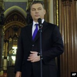 Prime Minister of Hungary Viktor Orban, right, listens to his Norwegian counterpart Jens Stoltenberg, left, during a press conference at the parliament building in Budapest, Hungary, January 12, 2011.