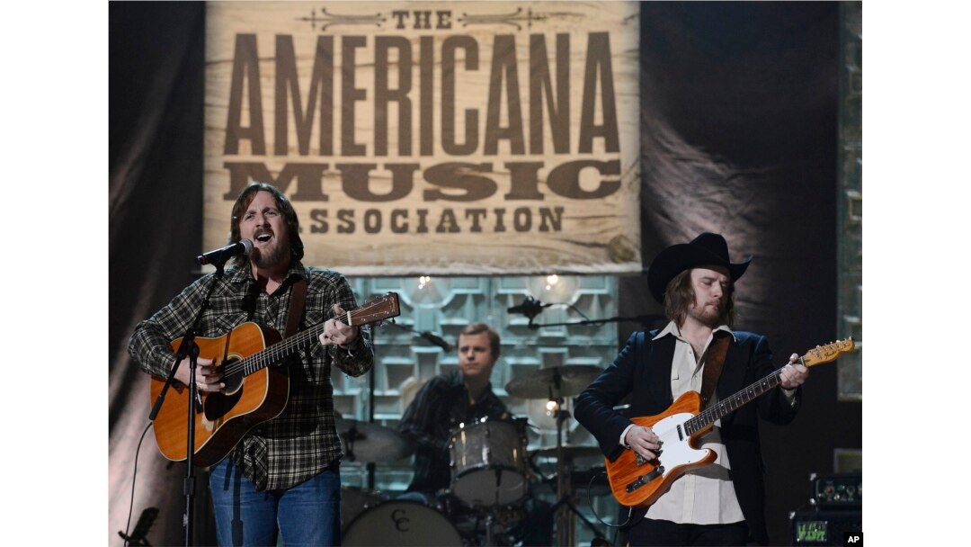 Sturgill Simpson, left, performs during the Americana Music Honors and Awards show, Sept. 17, 2014, in Nashville, Tennessee.