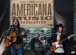 Sturgill Simpson, left, performs during the Americana Music Honors and Awards show, Sept. 17, 2014, in Nashville, Tennessee.