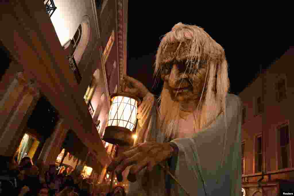 A member of street performance troupe Macnas participates in their 30th anniversary during Halloween parade called Savage Grace in Galway, Ireland, Oct. 30, 2016.
