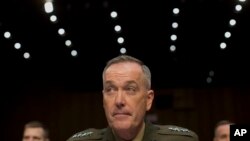 General Joseph Dunford, Commander of U.S.-led forces in Afghanistan, testifies on Capitol Hill, March 12, 2014.