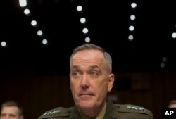 FILE - General Joseph Dunford testifies on Capitol Hill, March 12, 2014.