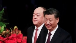 中国国家主席习近平与新任澳门行政长官贺一诚在澳门抵达就职仪式会场。（2019年12月20日）