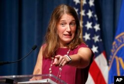 FILE - Health and Human Services Secretary Sylvia Burwell speaks during a news conference at the HHS in Washington, Oct. 19, 2016. The Obama administration says 6.4 million people have signed up so far this year for subsidized private insurance coverage through HealthCare.gov.