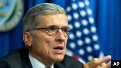 FILE - FCC Chairman Tom Wheeler, writing in Wired magazine, says he wants to protect the rights of Internet users through government regulation.