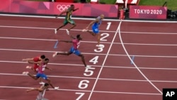 Lamont Marcell Jacobs, of Italy, wins the final of the men's 100-meters at the 2020 Summer Olympics, Sunday, Aug. 1, 2021, in Tokyo, Japan. (AP Photo/Francisco Seco)