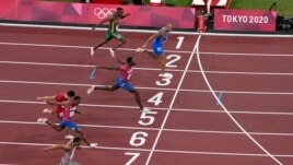 Lamont Marcell Jacobs, of Italy, wins the final of the men's 100-meters at the 2020 Summer Olympics, Sunday, Aug. 1, 2021, in Tokyo, Japan. (AP Photo/Francisco Seco)