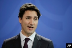 Prime Minister of Canada Justin Trudeau attends a news conference with German Chancellor Angela Merkel after talks at the chancellery in Berlin, Feb. 17, 2017.