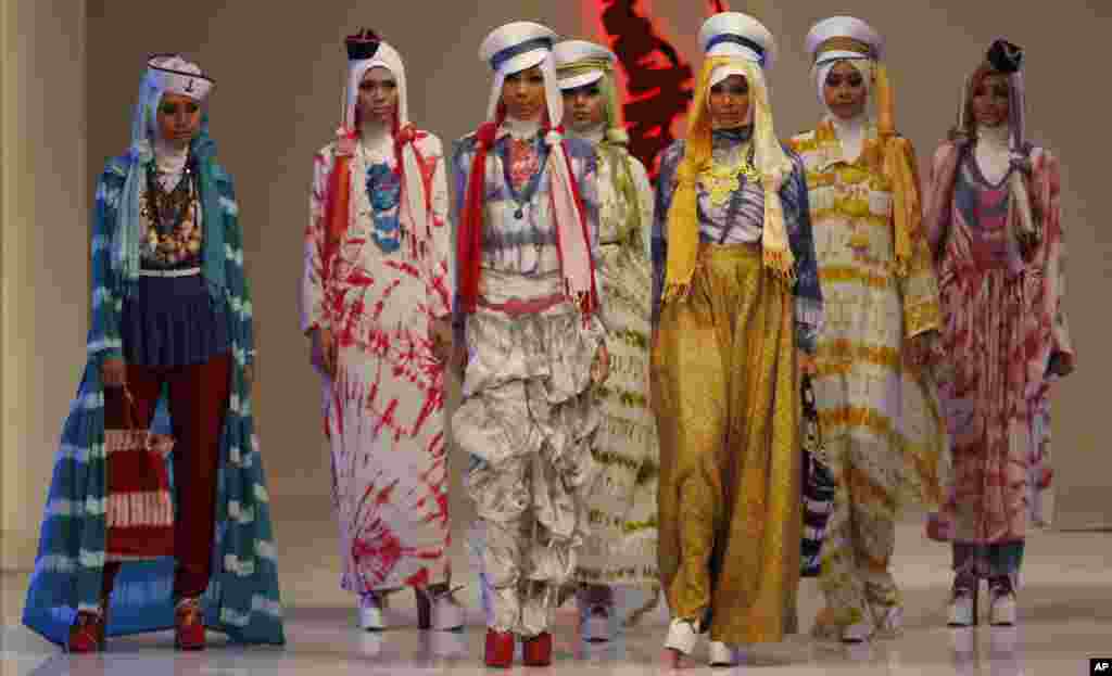 Models present a creation by Indonesian fashion designer Dian Pelangi during the Jakarta Fashion and Food Festival in Jakarta, Indonesia.