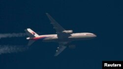 FILE - A Malaysian Airlines jet is seen during flight.