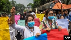 Bangladeshi students march along a street during a student protest in Dhaka, Aug. 4, 2018, following the deaths of two college students in a road accident. Parts of the Bangladeshi capital ground to a halt for the seventh day as thousands of students staged protests calling for improvements to road safety.