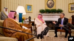 President Barack Obama meets with Saudi Arabia's Crown Prince Mohammed bin Nayef, center, and Deputy Crown Prince Mohammed bin Salman, left, in the Oval Office of the White House in Washington, May 13, 2015. 