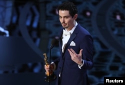 Damien Chazelle accepts the award for winning Best Director.
