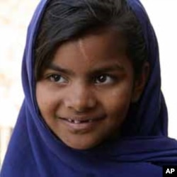 This photograph shows a young Pakistani girl, Javaria, who is now attending school.