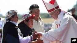 Pope Francis greets Mapuches in an offertory of a Mass at the Maquehue Air Base, in Temuco, Chile, Jan. 17, 2018. 