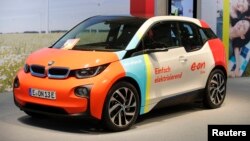FILE - A BMW 3 electric car is seen during the E.ON annual shareholders meeting in Essen, Germany, May 9, 2018. 