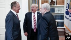 U.S. President Donald Trump meets with Russian Foreign Minister Sergey Lavrov, left, next to Russian Ambassador to the U.S. Sergei Kislyak at the White House in Washington, May 10, 2017.