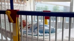 In this June 2021 photo provided by LaRanda St. John, her 6-week-old son, Beau, lies in a hospital bed at the Sarah Bush Lincoln Health Center in Matoon, Illinois. (LaRanda St. John via AP) 