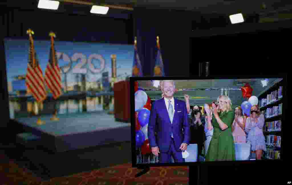 Democratic presidential candidate former Vice President Joe Biden is seen in a video feed from Delaware with his wife Jill Biden and his grandchildren during the virtual Democratic National Convention in Milwaukee, Wisconsin, Aug. 18, 2020.