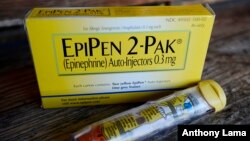 FILE - An EpiPen epinephrine auto-injector, a Mylan product, is displayed in Hendersonville, Texas, Oct. 10, 2013. 