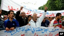 FILE - Unemployed protesters demonstrate in Tunis, Tunisia, Jan. 22, 2016. Seven years after the Arab Spring, little has been done to address youth unemployment in Tunisia, rights groups and experts say.