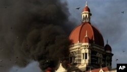 This file photograph taken on 27 Nov 2008 shows flames gushing out of The Taj Mahal Hotel in Mumbai, one of the sites attacked by alleged militant gunmen