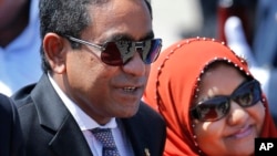 FILE - Maldives President Abdulla Yameen Abdul Gayoom, accompanied by his wife, Fathimath Ibrahim, arrives in Colombo, Sri Lanka, July 22, 2015.