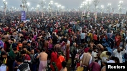 Devotees gather to take a dip at the confluence of the Ganges and Yamuna rivers during the Maha Kumbh Mela, or the Great Pitcher Festival, in Prayagraj, India, on Feb. 12, 2025.