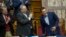 Greek Prime Minister Alexis Tsipras, right, is applauded by lawmakers after the end of his speech during a parliamentary session, in Athens, June 16, 2018. 