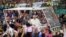 Pope Francis greets the crowd of faithful from a popemobile in Quito, Ecuador, July 5, 2015. 