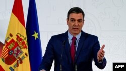 File - Spain's Prime Minister Pedro Sanchez delivers a speech at La Moncloa Palace in Madrid on December 29, 2021. Spain said Monday that the mobile phones of the prime minister Pedro Sanchez and Defense Minister Margarita Robles were tapped using Pegasus spyware.
