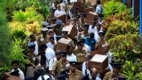 Polling officers and police officers wait in line as they prepare to go to their polling centers ahead of the first provincial polls in 25 years in Jaffna, a former war zone in northern Sri Lanka, about 400 kilometres (249 miles) north of Colombo.