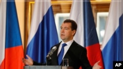 Russia's President Dmitry Medvedev attends a news conference at Prague Castle, December 8, 2011.