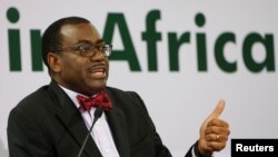 FILE - African Development Bank (AfDB) President Akinwumi Adesina gestures as he addresses a news conference at the annual meeting of AfDB in Gandhinagar, India, May 22, 2017.