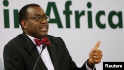 FILE - African Development Bank (AfDB) President Akinwumi Adesina gestures as he addresses a news conference at the annual meeting of AfDB in Gandhinagar, India, May 22, 2017.