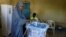 FILE - A woman casts her ballot in the Presidential election at a polling station in Hargeisa, Somaliland, Nov. 13, 2017. Protests have followed the election, with one opposition party claiming "massive" polling irregularities.