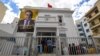 FILE - A poster of imprisoned presidential candidate Ayachi Zammel is displayed at the entrance of his electoral headquarters on Sept. 16, 2024, in Tunis, ahead of presidential election. 