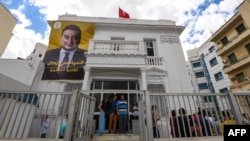 FILE - A poster of imprisoned presidential candidate Ayachi Zammel is displayed at the entrance of his electoral headquarters on Sept. 16, 2024, in Tunis, ahead of presidential election. 