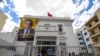 FILE - A poster of imprisoned presidential candidate Ayachi Zammel is displayed at the entrance of his electoral headquarters on Sept. 16, 2024, in Tunis, ahead of presidential election. 