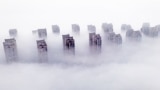 Residential buildings are shrouded in fog in Lianyungang, in eastern China's Jiangsu province, on March 12, 2025. 