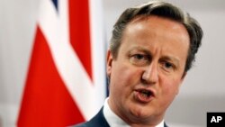 FILE - British Prime Minister David Cameron speaks during a media conference.