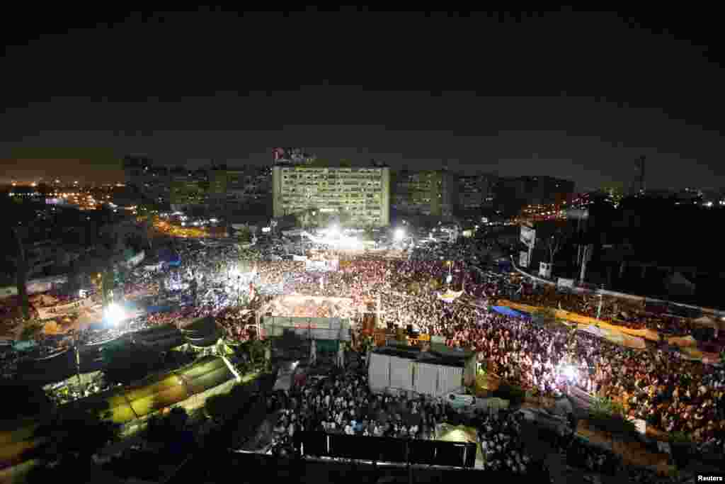 Members of the Muslim Brotherhood and supporters of deposed Egyptian President Mohamed Morsi gather at Rabaa Adawiya square, where they are camping, Cairo, July 12, 2013. 