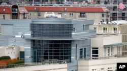 An American flag waves on top of the US embassy in Berlin, Oct. 28, 2013. 